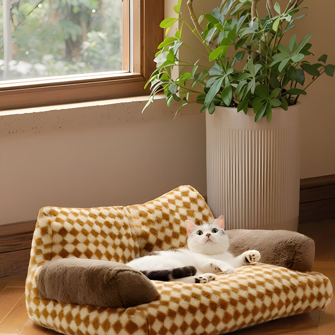 Luxury pet furniture: grey plush cat bolster sofa with a machine washable cover.