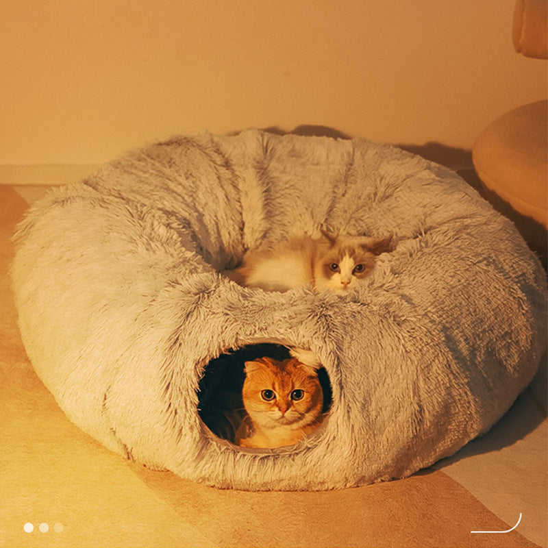 Soft cat bed and play tunnel in one, offering pet comfort and hideaway for feline friends.