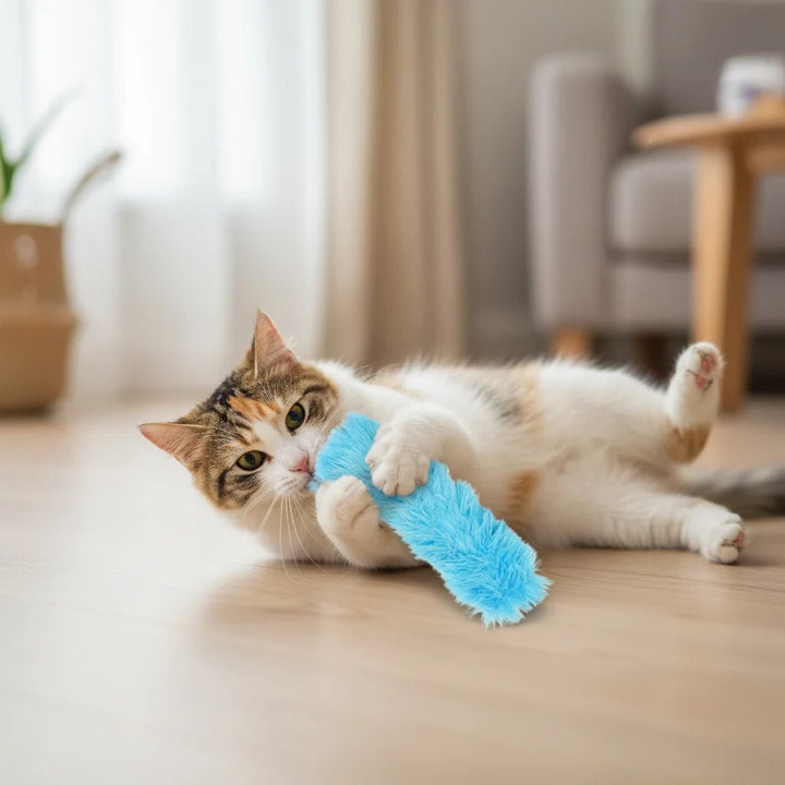 Cat playing with an interactive catnip plush toy, enjoying a stimulating playtime accessory.