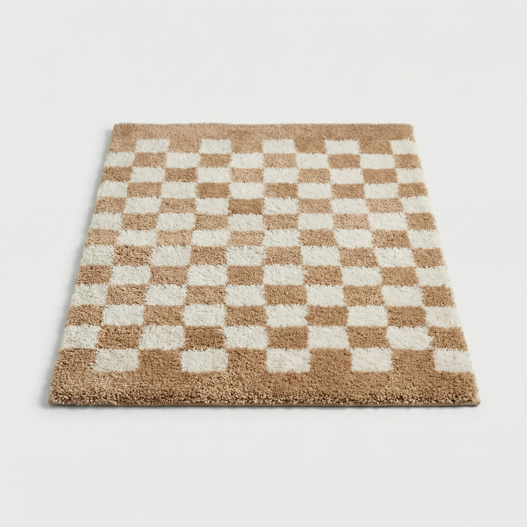 Luxurious plush checkered bath mat, super soft and absorbent, perfect for stylish bathroom floors.