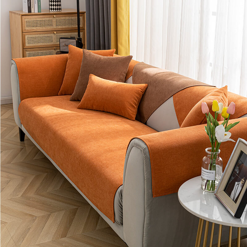 Close-up of soft chenille fabric on a sofa protector, highlighting texture and quality