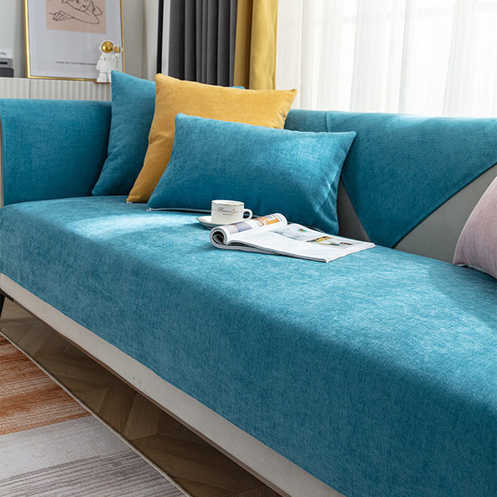 Corner of a sectional sofa with a non-slip chenille cover, showcasing secure fit