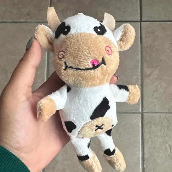 Interactive cow plush dog toy, ideal for stress relief & dental care in pets.