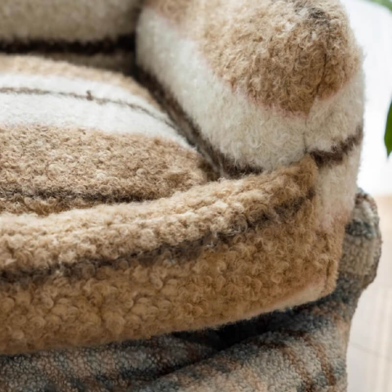 Indoor pet bed, plush grey sofa with high walls for extra coziness, washable.