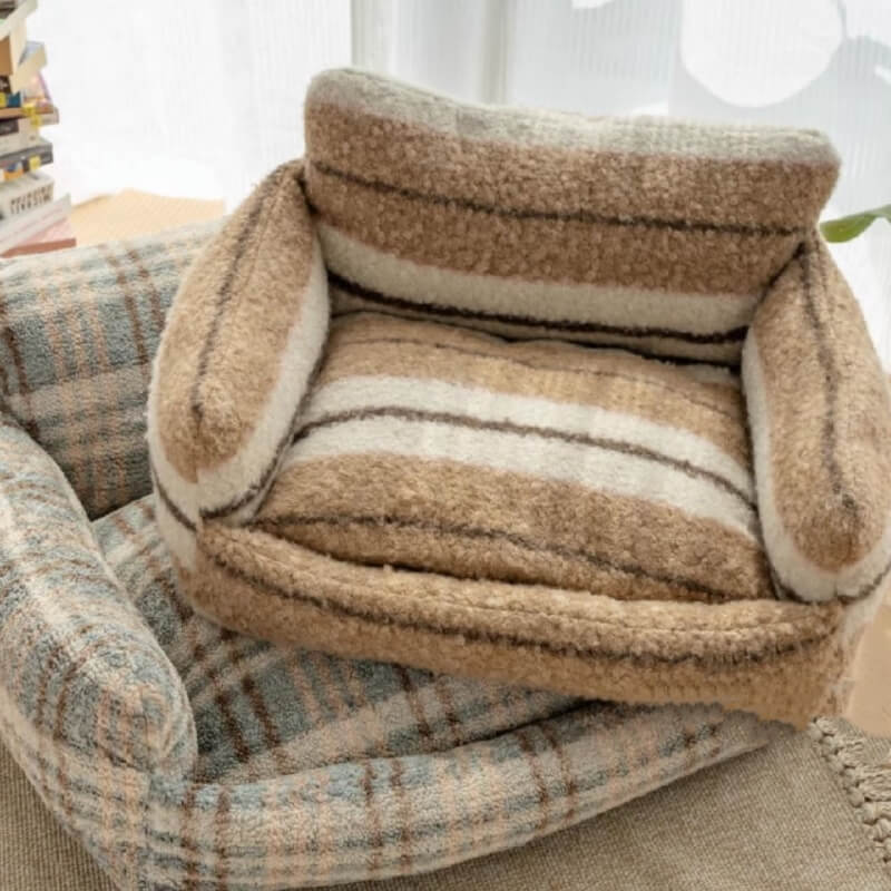 Luxury pet sofa, ultra-soft plush fabric, provides warmth and support for pets.