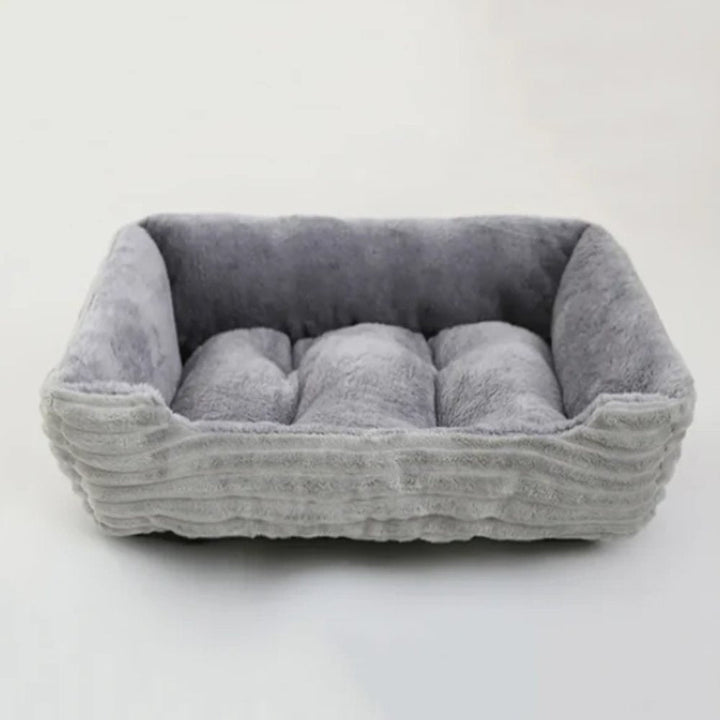 Plush dog bed in a cozy, round design for ultimate pet comfort and relaxation, perfect for any small or medium dog.