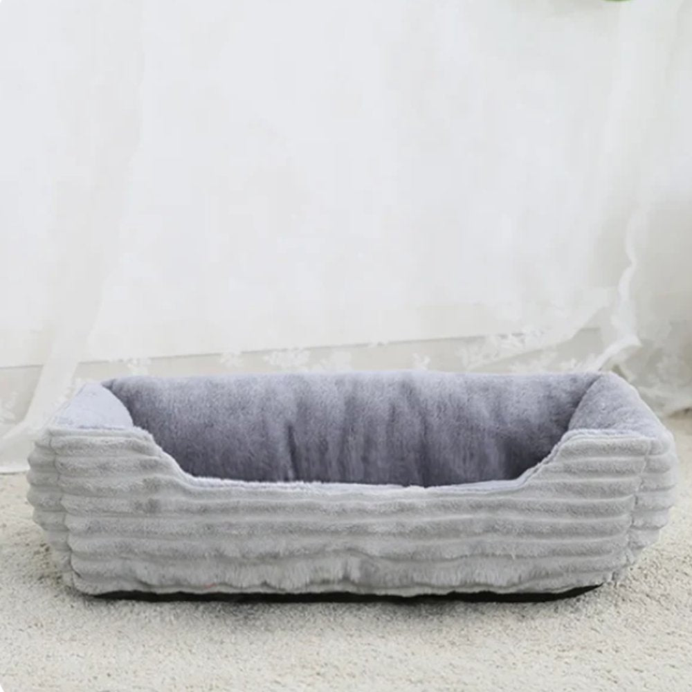 Durable, washable dog bed featuring a plush, cozy surface for maximum pet comfort and a non-slip bottom.