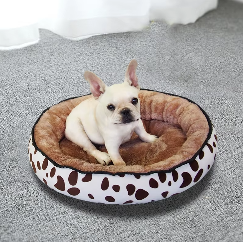 Plush dog bed with black and white polka dot design, soft and comfortable for pets