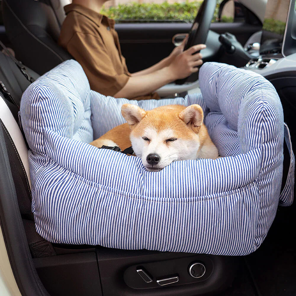 Cozy dog car seat for pet travel, durable grey fabric and secure clip.