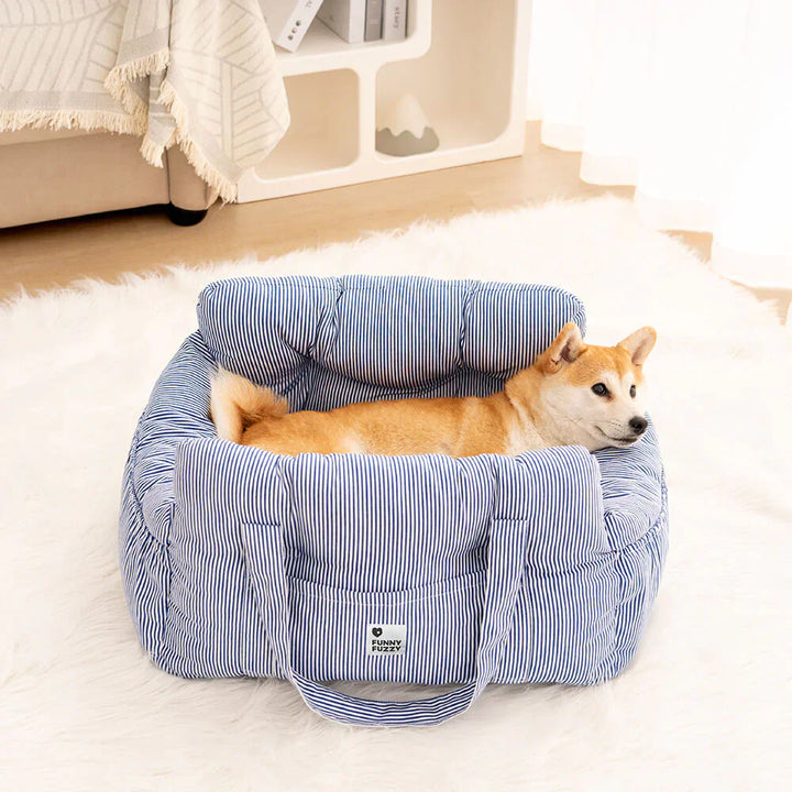Secure dog car seat with adjustable straps, plush interior for comfortable travel.