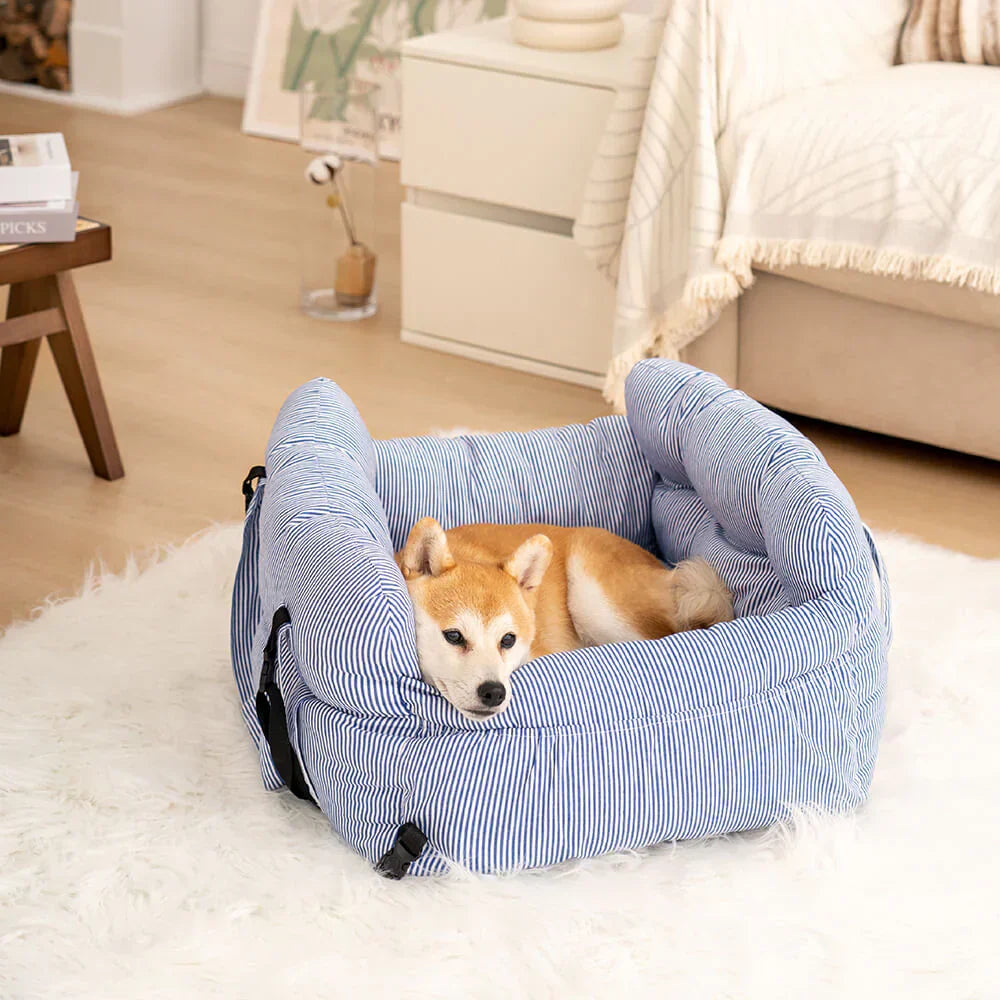Front-facing dog car seat, pet safety booster, grey cushioned interior.