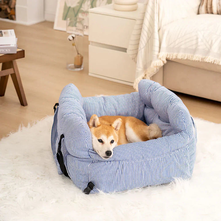 Front-facing dog car seat, pet safety booster, grey cushioned interior.