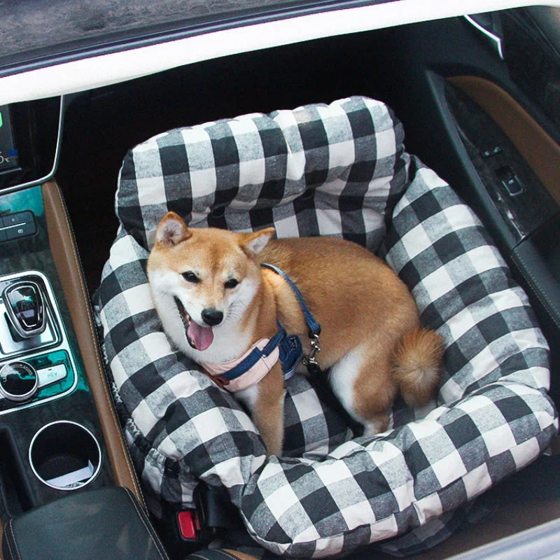 Soft dog car seat offering a cozy bed for pets on car journeys, easy install.