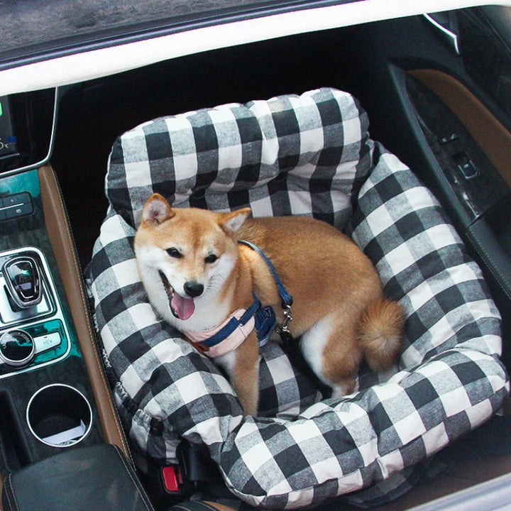 Soft dog car seat offering a cozy bed for pets on car journeys, easy install.