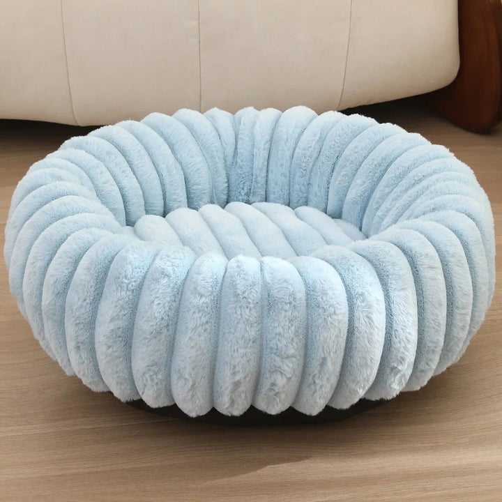 Brown plush donut dog bed, extra soft, creating a calming environment for small pets.