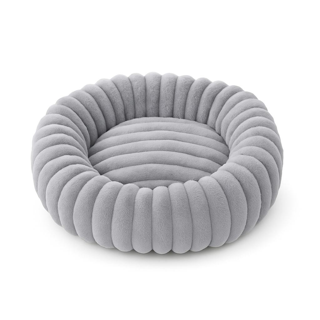 Soft, washable plush donut dog bed providing comfort for anxious small dogs.