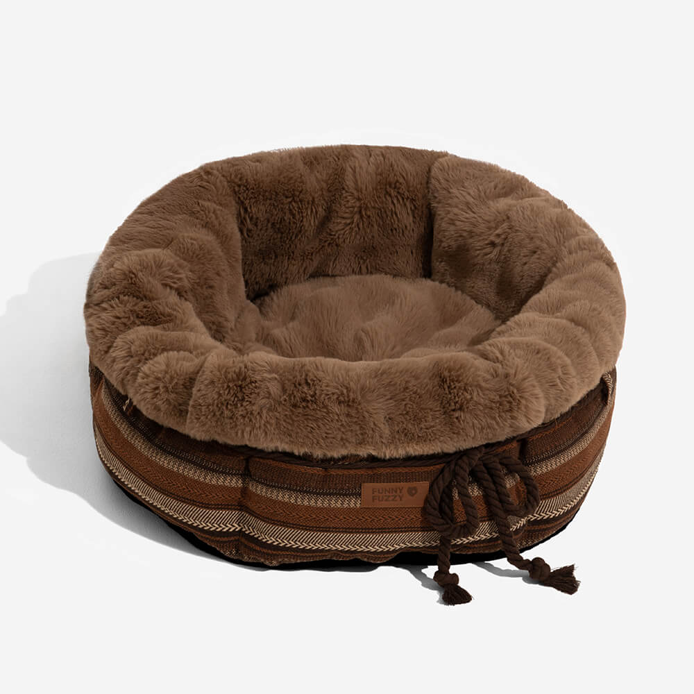 Deep plush donut dog bed in a soft beige, providing a snug spot for pets.