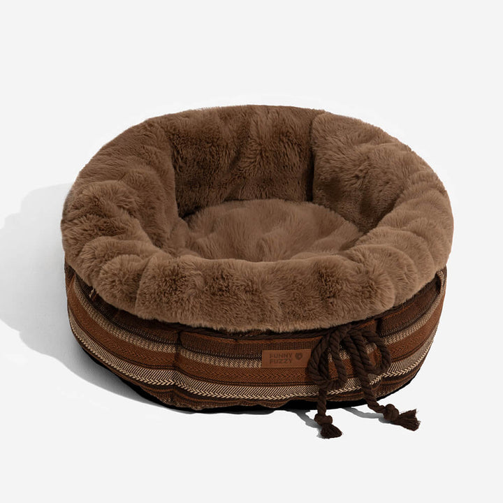 Deep plush donut dog bed in a soft beige, providing a snug spot for pets.