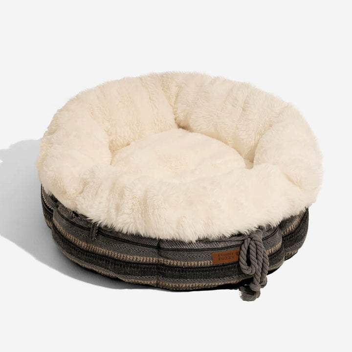 Non-slip pet bed, plush donut shape, in a calming color for small to medium dogs.
