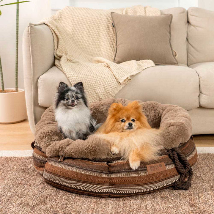 Warm gray plush donut dog bed with non-slip bottom for small to medium pets.