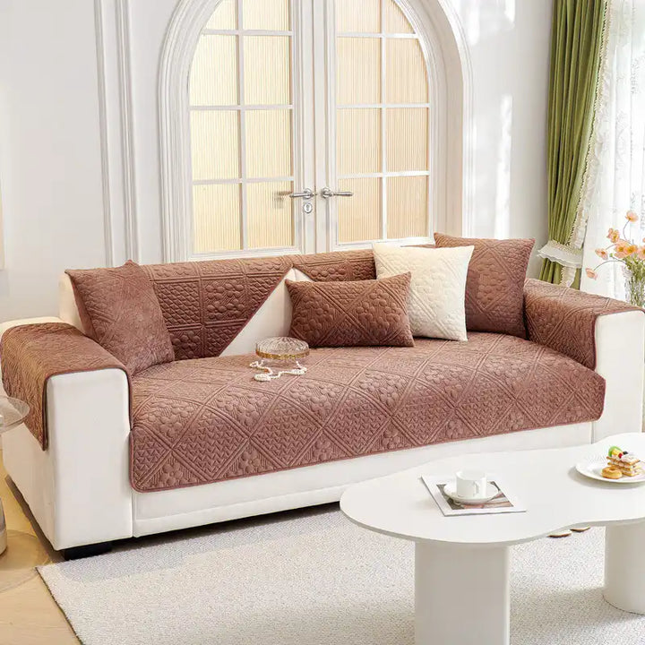 Soft plush geometric sofa protector, non-slip, washable, adds style and comfort.