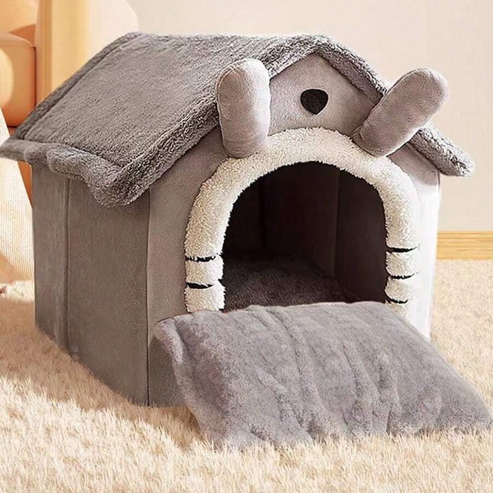 Plush enclosed cat house bed in gray, offering cozy comfort for pets.