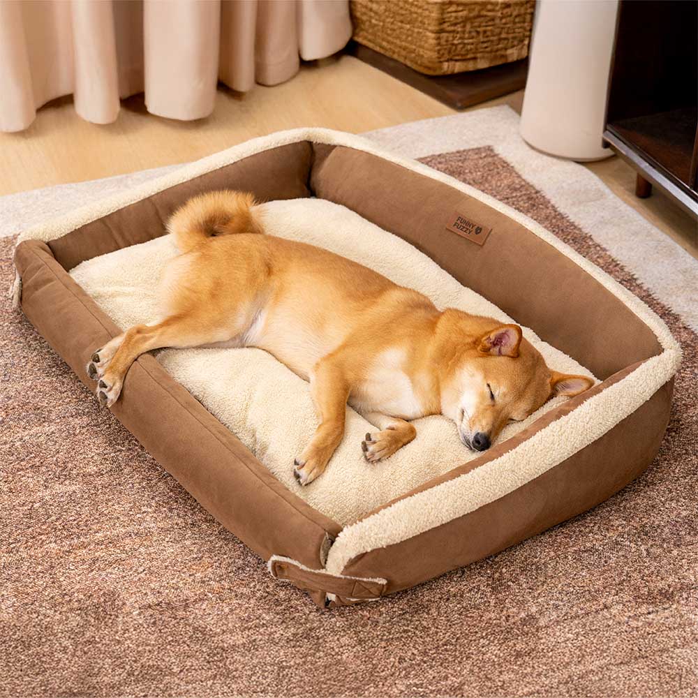 Top view of a gray ergonomic dog bed, highlighting its expandable design