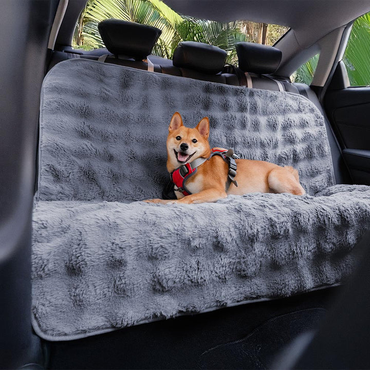 Washable dog blanket/car seat protector, featuring soft faux fur for a pet's cozy ride.