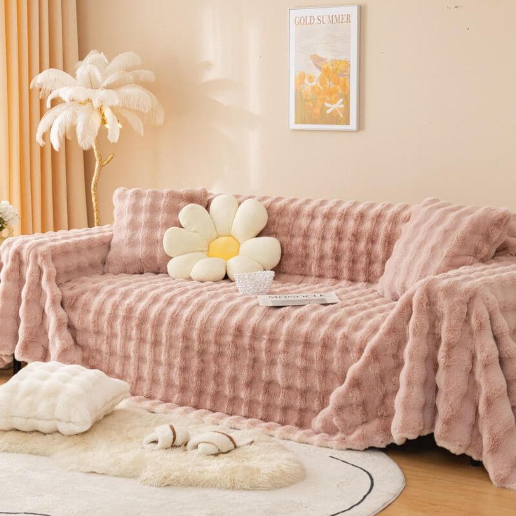 Full view of a living room sofa covered with a soft faux fur slipcover, enhancing home decor