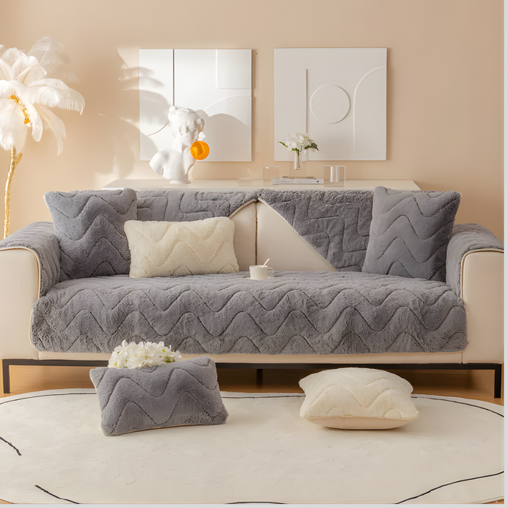 Dark gray plush faux fur furniture cover, non-slip, pet-friendly, ideal for sofas and sectionals.