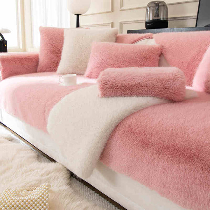 Plush faux fur non-slip sofa cover shown tightly fitted to a three-seater couch.