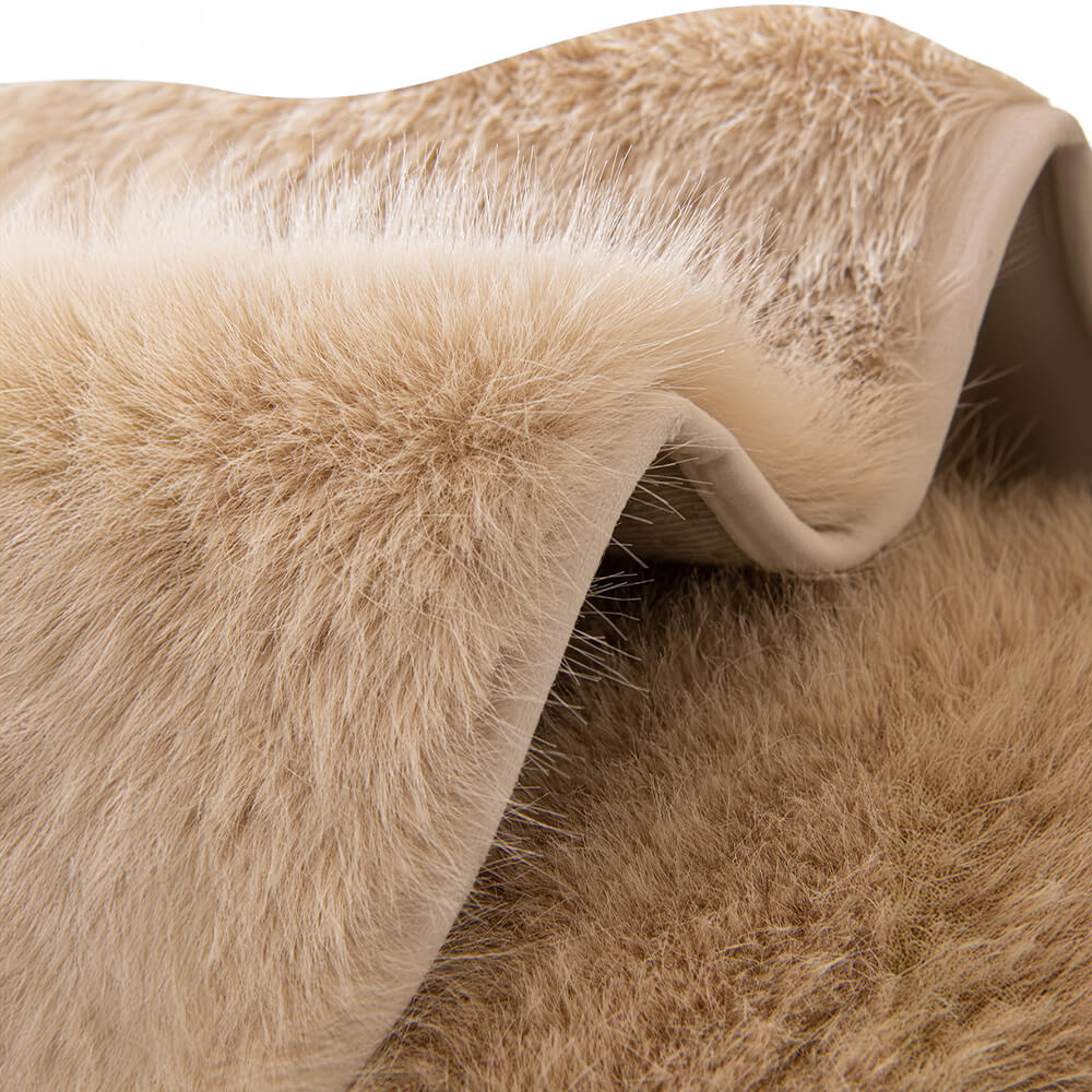 Elegant plush faux fur furniture protector enhancing the look and feel of a sofa.