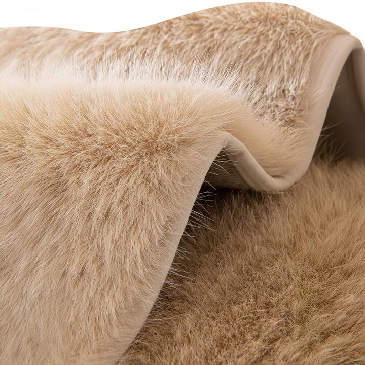 Elegant plush faux fur furniture protector enhancing the look and feel of a sofa.