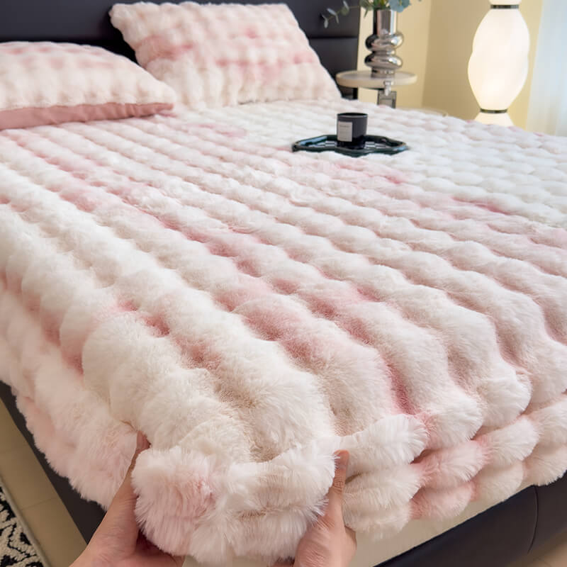 Soft faux fur mattress protector on a bed, showcasing luxurious bedroom comfort