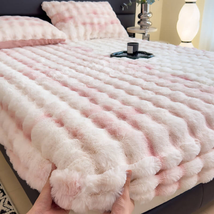 Soft faux fur mattress protector on a bed, showcasing luxurious bedroom comfort