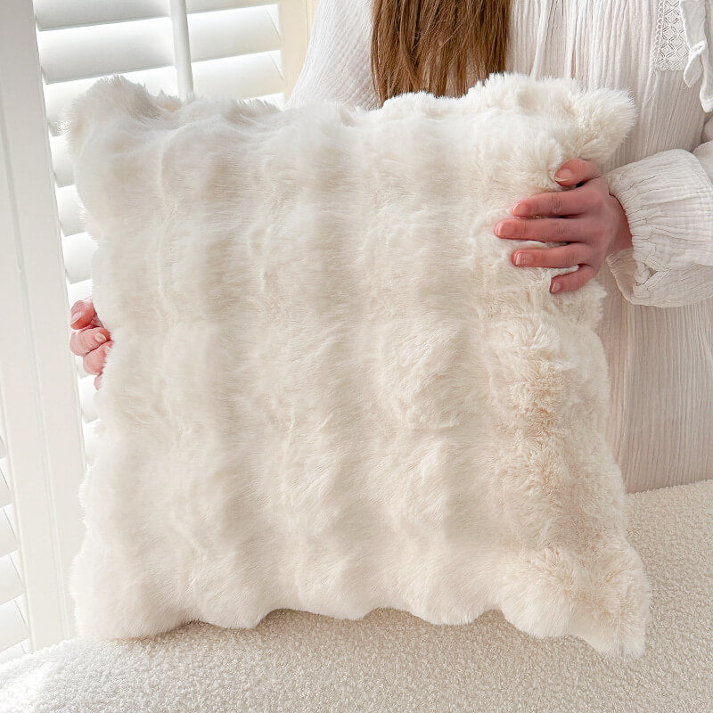 Pet-friendly faux rabbit fur couch cover, ideal for protecting furniture while maintaining a chic aesthetic.