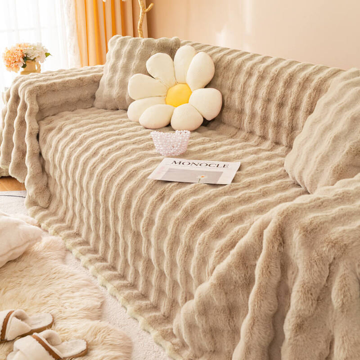Elegant faux rabbit fur sofa cover in a neutral color, offering skin-friendly and durable couch protection.
