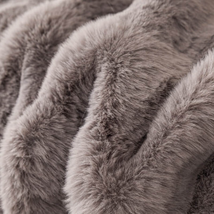 Skin-friendly faux rabbit fur sofa cover, a cozy addition to any living room, easy to maintain.