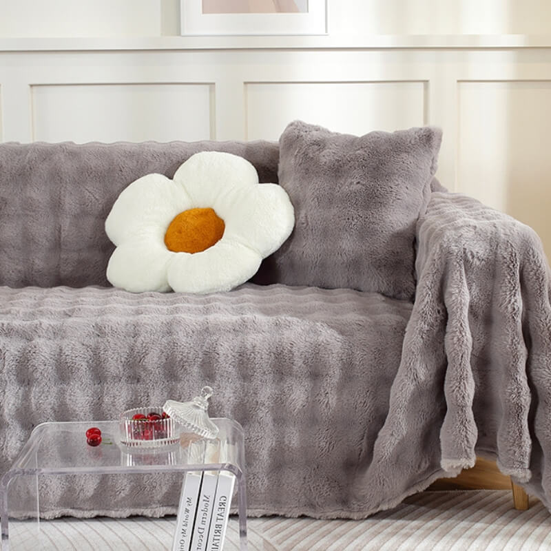 Durable faux rabbit fur sofa protector, pet-friendly and plush, safeguarding furniture from wear and tear.