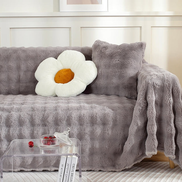 Durable faux rabbit fur sofa protector, pet-friendly and plush, safeguarding furniture from wear and tear.
