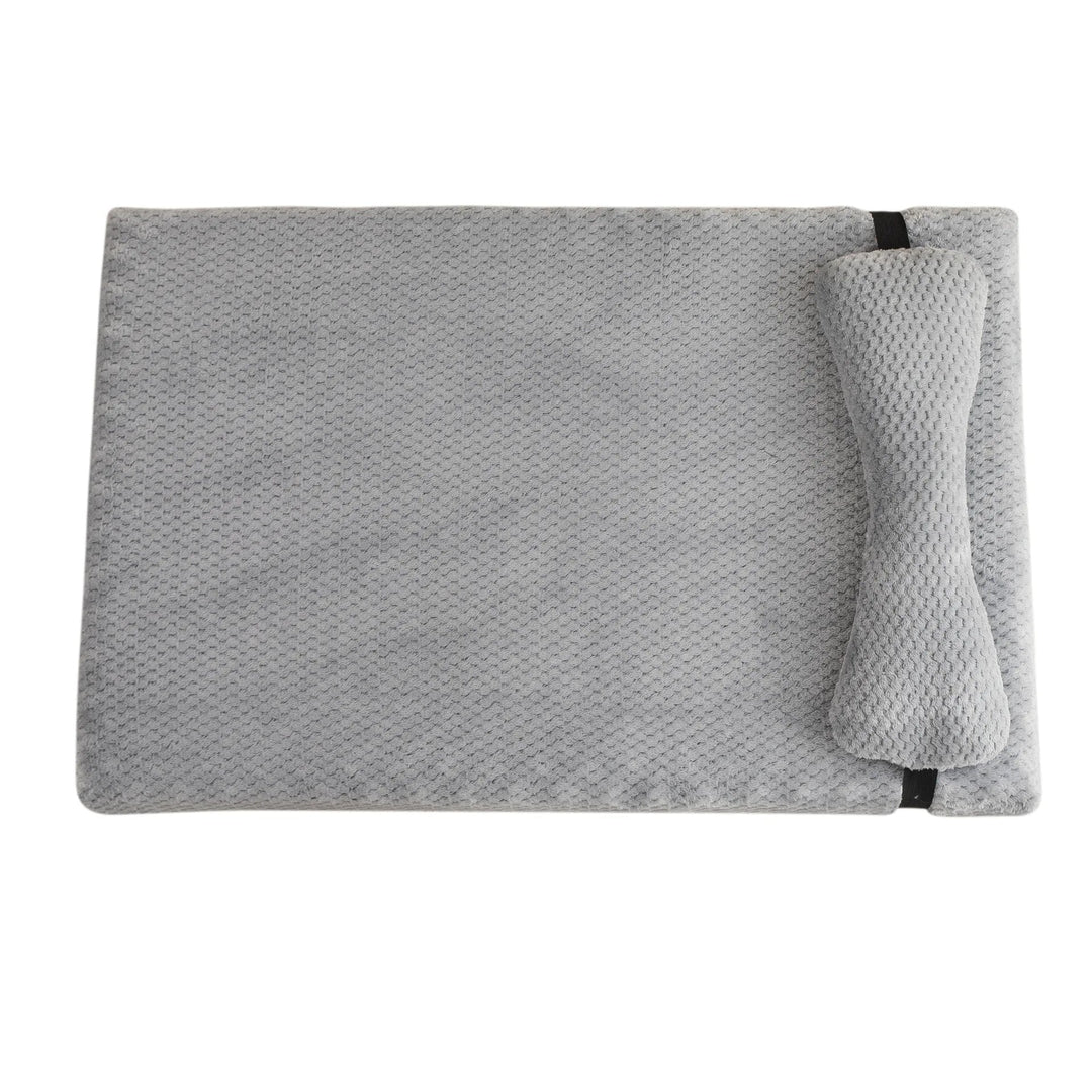 Durable and washable pet mat for cats and dogs, featuring a cozy pillow for head support.