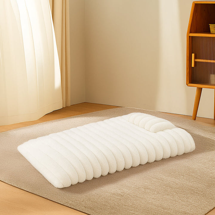 Stylish fluffy dog bed, a calming pet accessory with an attached pillow for support.
