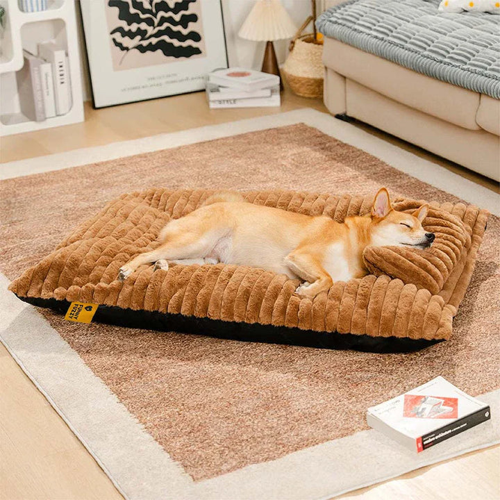 Premium plush calming dog bed, a luxurious sleep aid with a supportive integrated pillow.