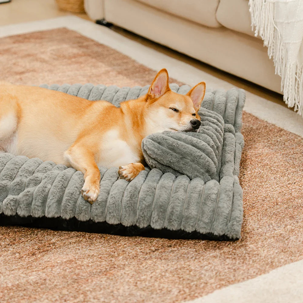 Unisex calming dog bed, ultra-soft plush fabric, promotes restful sleep for pets.