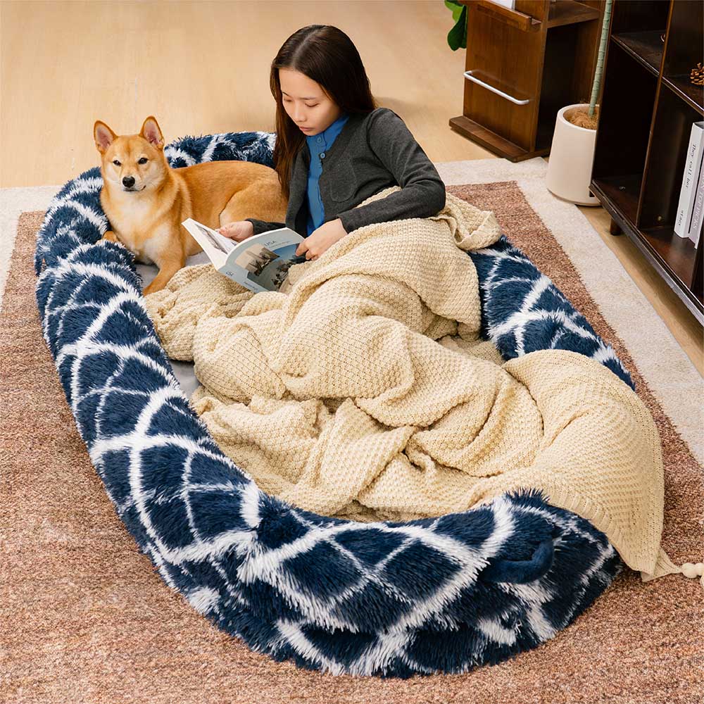 Plush fluffy donut pet & human cuddle bed in a light color, perfect for cozy pet comfort.