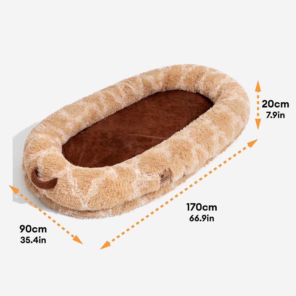 Unisex fluffy donut dog bed in a living room setting, blending as stylish pet furniture.