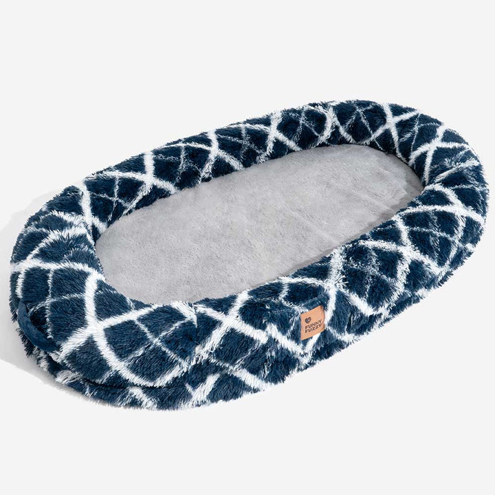 Detail shot of the faux fur on the fluffy donut pet bed, emphasizing its soft and plush texture.