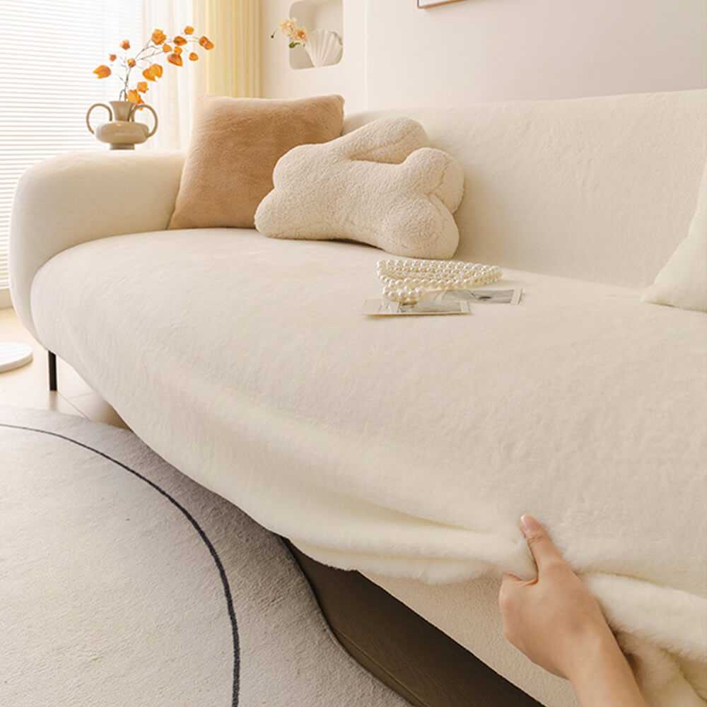 Ultra-soft plush sofa cover with full coverage, showing its stretch and elastic fit to protect upholstery.