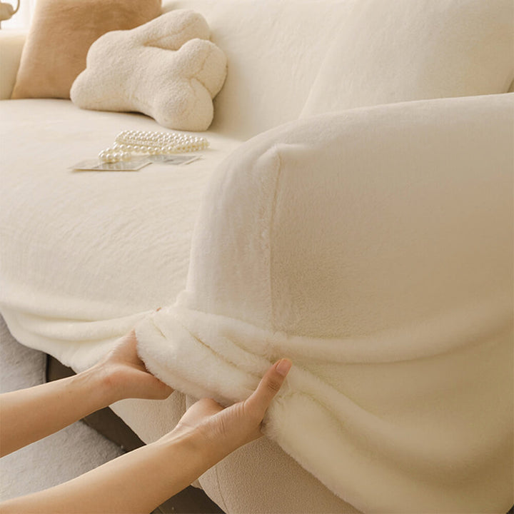 Skin-friendly plush couch protector in a modern living room setting, highlighting its soft texture.