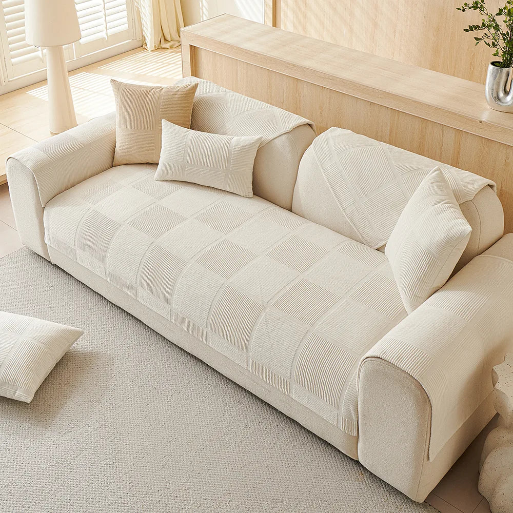 Functional and chic geometric plush couch protector, machine washable for easy maintenance.